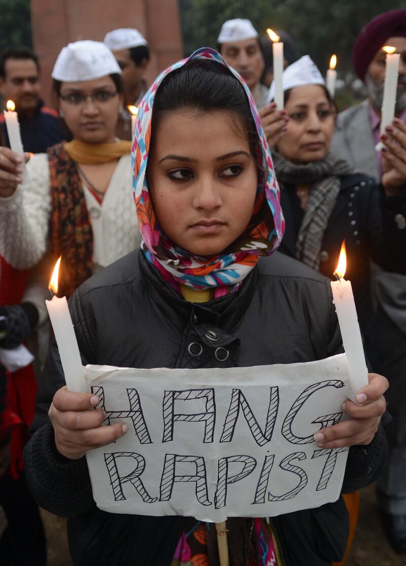 Members of India's Aam Aadmi Party (AAP) take part in a candlelight march in Amritsar on December 30, 2012, after the cremation ceremony for a gangrape victim. The victim of a gang-rape and murder which triggered an outpouring of grief and anger across India was cremated at a private ceremony, hours after her body was flown home from Singapore. A student of 23-year-old, the focus of nationwide protests since she was brutally attacked on a bus in New Delhi two weeks ago, was cremated away from the public glare at the request of her traumatised parents. AFP PHOTO/NARINDER NANU
 *** Local Caption ***  174108-01-08.jpg