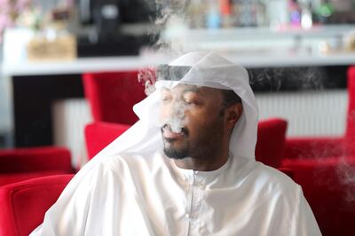 Ras Al Khaimah, United Arab Emirates - Reporter: Salem Al Ali smokes shisha at Orkied Cafe. Shisha cafes are now opening in RAK. Thursday, August 6th, 2020. Ras Al Khaimah. Chris Whiteoak / The National