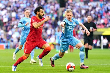 Liverpool's Mohamed Salah (left) and Manchester City's Oleksandr Zinchenko battle for the ball during the Emirates FA Cup semi final match at Wembley Stadium, London. Picture date: Saturday April 16, 2022.