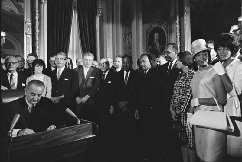Martin Luther King Jr among the leaders behind former US President Lyndon B Johnson at the August 1965 signing of the Voting Rights Act. Photo: US National Archives