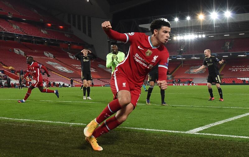 epa08856162 Curtis Jones of Liverpool celebrates after scoring the opening goal during the UEFA Champions League group D soccer match between Liverpool FC and Ajax Amsterdam in Liverpool, Britain, 01 December 2020.  EPA/Paul Ellis / POOL