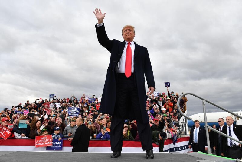 TOPSHOT - US President Donald Trump arrives for a "Make America Great Again" rally at Bozeman Yellowstone International Airport, November 3, 2018 in Belgrade, Montana.  With rallies in Montana and Florida, a state he had already visited on Wednesday, Trump on Saturday is keeping up his relentless campaign schedule before Tuesday's ballot, which has become a referendum on his unconventional presidency. / AFP / Nicholas Kamm
