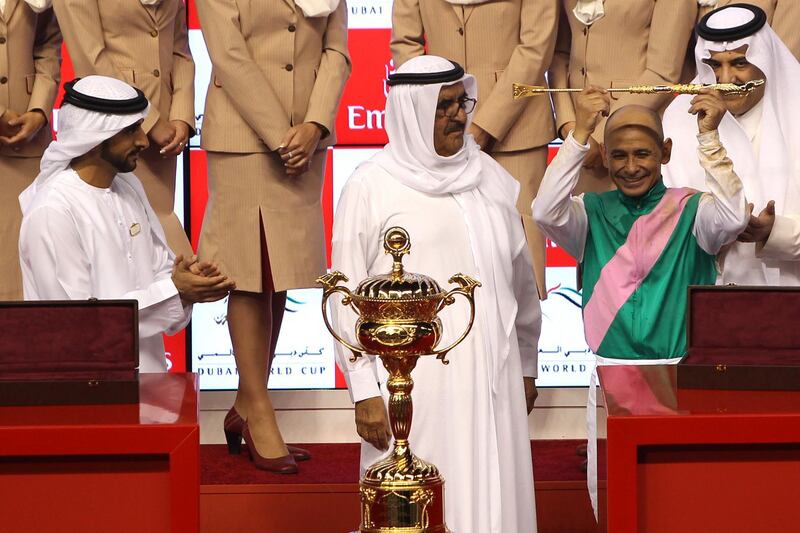 epa05870456 His Highness Sheikh Hamdan bin Rashid al-Maktoum and HH Sheikh Hamdan bin Mohammed Rashid al-Maktoum, Crown Prince of Dubai presents golden stick to world cup winning jockey Mike Smith during the prize ceremony of Dubai World Cup main race at the Meydan race course in Gulf Emirate of Dubai, United Arab Emirates, 25 March 2017.The Dubai World Cup is one of the richest events in the horse racing sporting calendar  EPA/STR