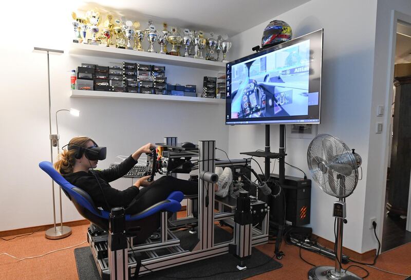 Formula 3 racer Sophia Floersch rides in a simulator during her home training, amid the coronavirus disease (COVID-19) outbreak in Gruenwald near Munich, Germany. REUTERS
