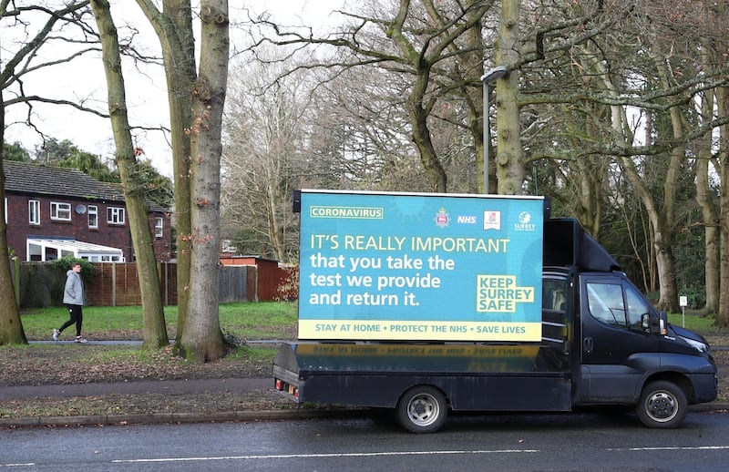 An advertisement board is seen urging people to take a test in Woking. Reuters