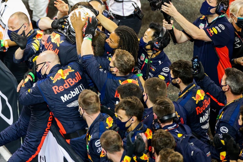 Max Verstappen celebrates with his Red Bull team after winning in Abu Dhabi. Getty