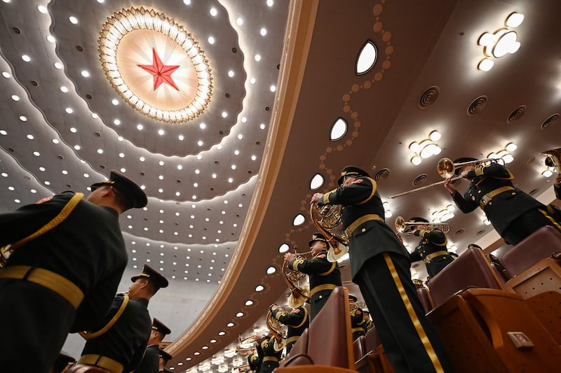 The People's Liberation Army band performs before the opening ceremony of the Chinese People's Political Consultative Conference at the Great Hall of the People in Beijing. AFP