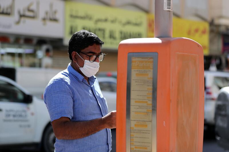 Dubai, United Arab Emirates - Reporter: N/A. News. Coronavirus/Covid-19. A man pays for his parking in Bur Dubai. Saturday, October 17th, 2020. Dubai. Chris Whiteoak / The National