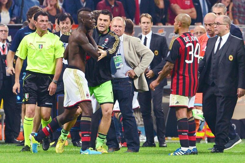 AC Milan striker Mario Balotelli, with shirt off, is sent off at the end of the Napoli defeat. Giuseppe Cacace / AFP