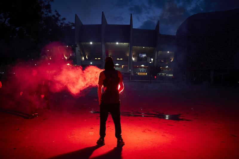 A Paris Saint-Germain fan taunts French riot police. Getty