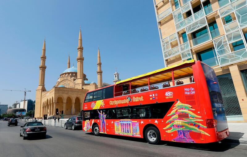 A city sightseeing bus is pictured parked outside Beirut's landmark Mohammad Al Amin mosque.   AFP