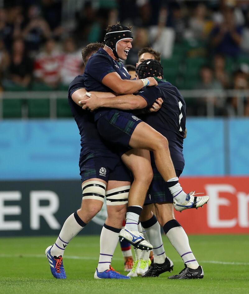 George Turner of Scotland celebrates with teammates after scoring his team's fifth try during the Rugby World Cup 2019 Group A game between Scotland and Russia at Shizuoka Stadium Ecopa in Fukuroi, Shizuoka, Japan. Getty Images