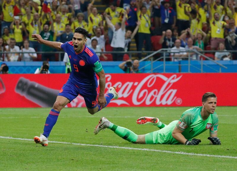 epa06837583 Radamel Falcao (L) of Colombia celebrates after scoring the 0-2 goal during the FIFA World Cup 2018 group H preliminary round soccer match between Poland and Colombia in Kazan, Russia, 24 June 2018.

(RESTRICTIONS APPLY: Editorial Use Only, not used in association with any commercial entity - Images must not be used in any form of alert service or push service of any kind including via mobile alert services, downloads to mobile devices or MMS messaging - Images must appear as still images and must not emulate match action video footage - No alteration is made to, and no text or image is superimposed over, any published image which: (a) intentionally obscures or removes a sponsor identification image; or (b) adds or overlays the commercial identification of any third party which is not officially associated with the FIFA World Cup)  EPA/ROBERT GHEMENT   EDITORIAL USE ONLY