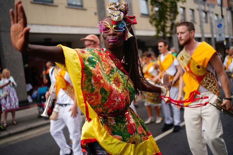 Performers dance during the children's parade. AP 