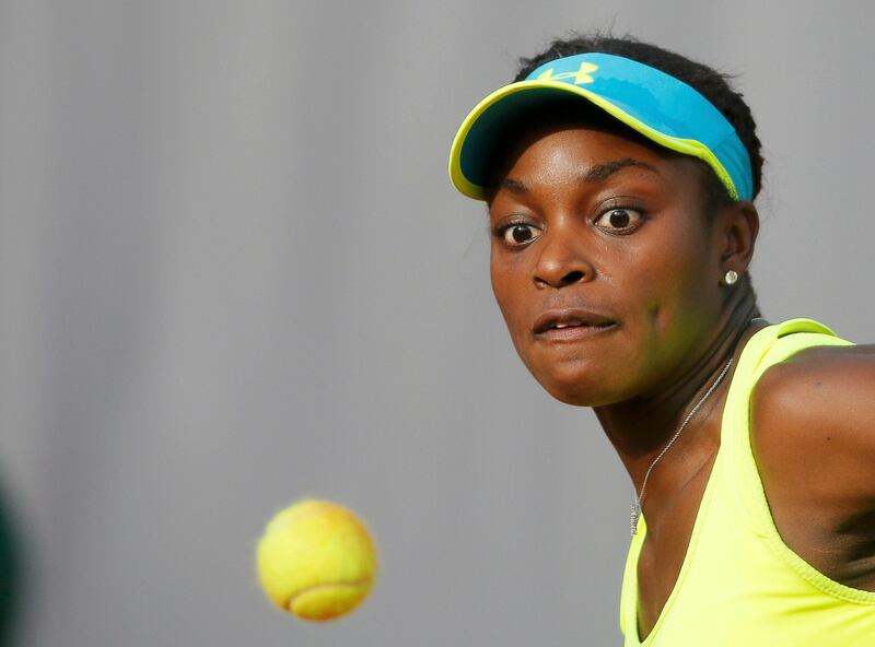 Sloane Stephens of the U.S. eyes the ball during her women's singles match against Maria Sharapova of Russia at the French Open tennis tournament at the Roland Garros stadium in Paris June 3, 2013. Stephens lost the match to Sharapova.   REUTERS/Gonzalo Fuentes (FRANCE  - Tags: SPORT TENNIS)   *** Local Caption ***  RGT261_TENNIS-OPEN-_0603_11.JPG