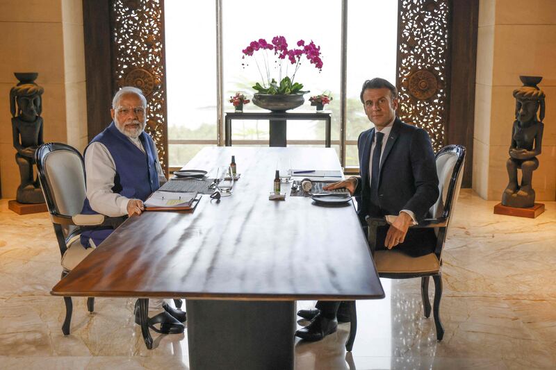 Mr Macron and Mr Modi hold a working lunch. AFP
