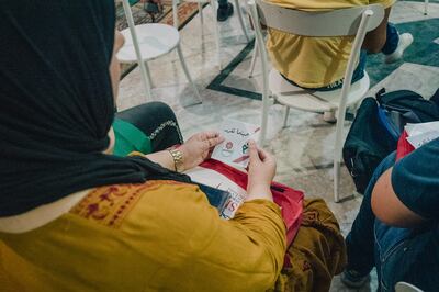 Election observers collect and inspect literature at a Yes campaign event in Tunis. Erin Clare Brown / The National