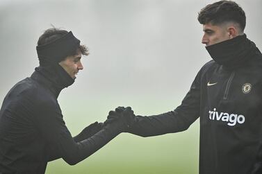 Chelsea's Portuguese striker Joao Felix (L) and Chelsea's German midfielder Kai Havertz (R) speak together as they attend a team training session at Chelsea's Cobham training facility in Stoke D'Abernon, southwest of London on February 14, 2023 on the eve of their UEFA Champions League round of 16 football match against Borussia Dortmund.  (Photo by Glyn KIRK  /  AFP)