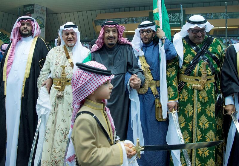 King Salman of Saudi Arabia performs the traditional Ardah sword dance as part of the activities of the Janadriyah cultural festival in Riyadh on February 20, 2018. Bandar Algaloud / Courtesy of Saudi Royal Court / Reuters