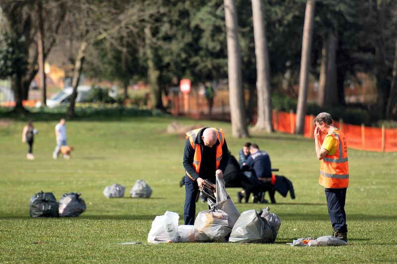 A council worker clears up a disposable barbecue in Cannon Hill Park, Birmingham, after yesterday's warm weather and the easing of England's lockdown restrictions saw groups of people congregating in parks, raising social distancing concerns. Picture date: Wednesday March 31, 2021. (Photo by Jacob King/PA Images via Getty Images)