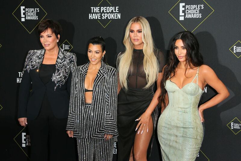 (FILES) In this file photo taken on November 10, 2019 (L-R) Business women/media personality Kris Jenner, Kourtney Kardashian, Khloé Kardashian and Kim Kardashian arrive for the 45th annual E! People's Choice Awards at Barker Hangar in Santa Monica, California. Fans will have to find another way to keep up with the Kardashians, as the mega-celebrity family announced on September 8, 2020 that their reality show will end next year. "It is with heavy hearts that we've made the difficult decision as a family to say goodbye to Keeping Up with the Kardashians," Kim Kardashian wrote in a post to her 188 million Instagram followers. / AFP / Jean-Baptiste Lacroix
