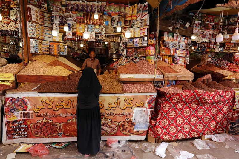 A Yemeni woman shops for Eid, marking the end of the Muslim fasting month of Ramadan, at a market in the old quarter of Sana'a, Yemen. EPA