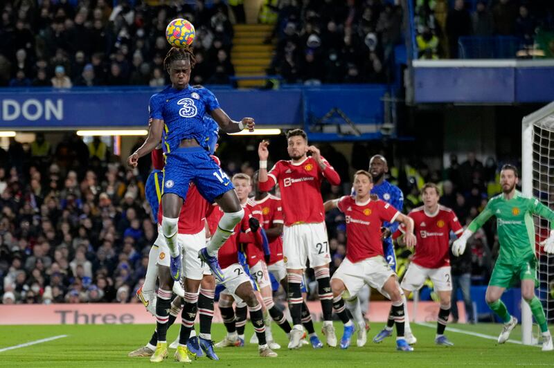 Chelsea defender Trevoh Chalobah heads the ball against Manchester United. AP