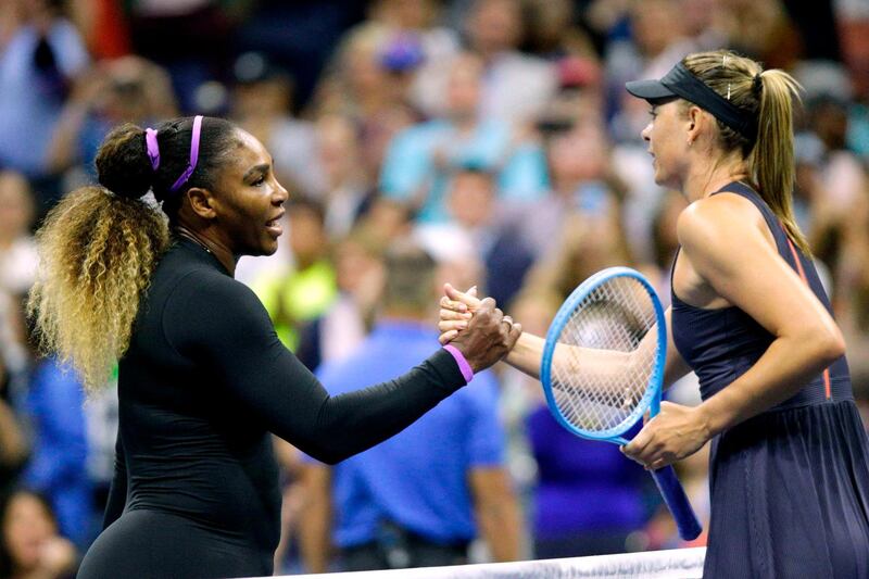 Maria Sharapova shakes hands after losing to Serena Williams. AFP