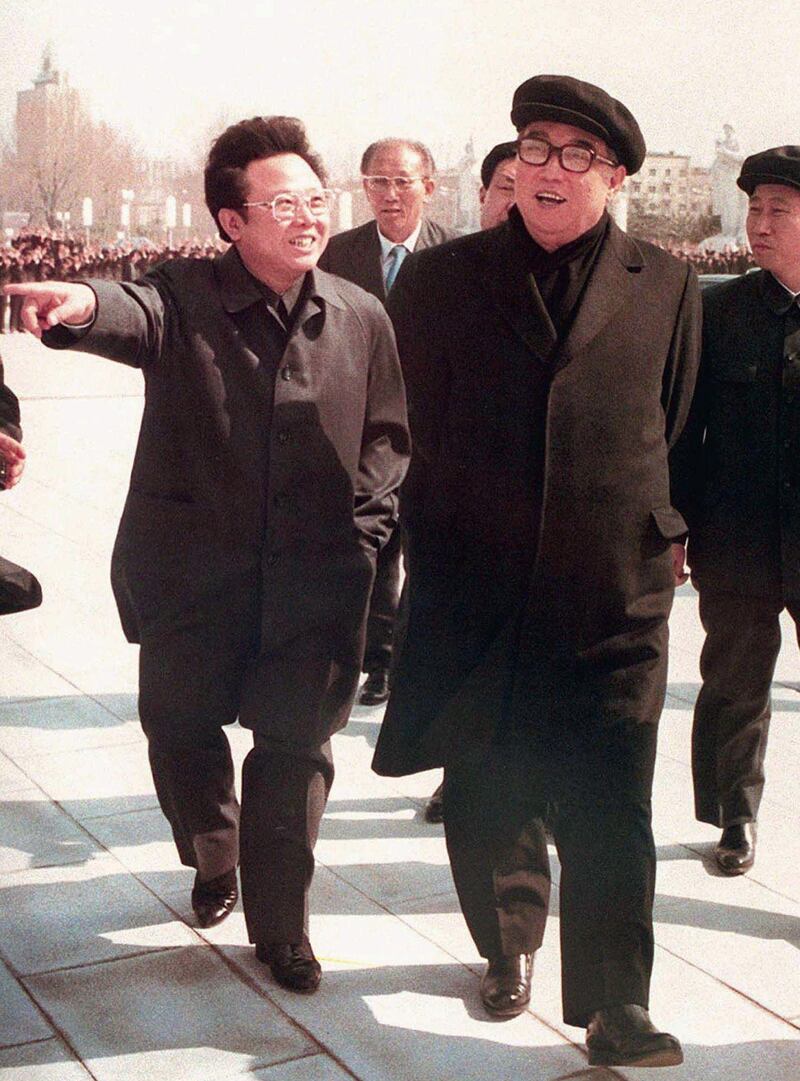 FILE - In this April 1981 file photo, North Korean leader Kim Jong Il gestures while taking a stroll with his father, Kim Il Sung, right, in Pyongyang, North Korea. Korean state television on Monday, Dec. 19, 2011 announced that Kim Jong Il, North Korea's mercurial and enigmatic leader, has died. He was 69. (AP Photo/Kyodo News) *** Local Caption ***  Korea Kim Jong Il.JPEG-08b18.jpg