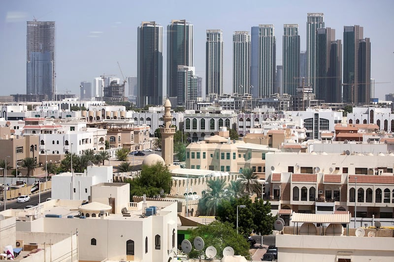 ABU DHABI, UNITED ARAB EMIRATES, Oct. 15, 2014:  
A view of the older parts of Abu Dhabi, backed by the new high-rise buildings on Al Reem Island in Abu Dhabi as seen on Wednesday, Oct. 15, 2014.  (Silvia Razgova / The National)

// Usage: undated
// Section: NA, BIZ
// Reporter:  stock

