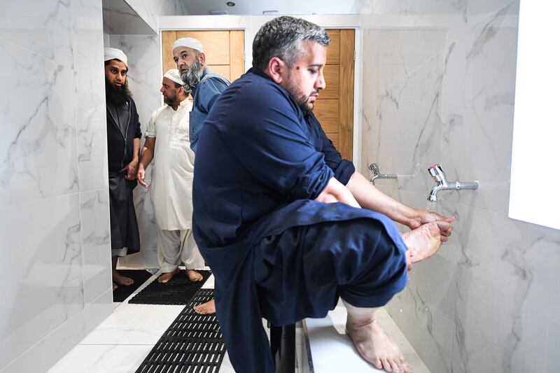 Members of the Muslim community attend the opening of the first mosque built on the Western Isles, Stornoway, Scotland, on May 11, 2018. Jeff J Mitchell / Getty Images