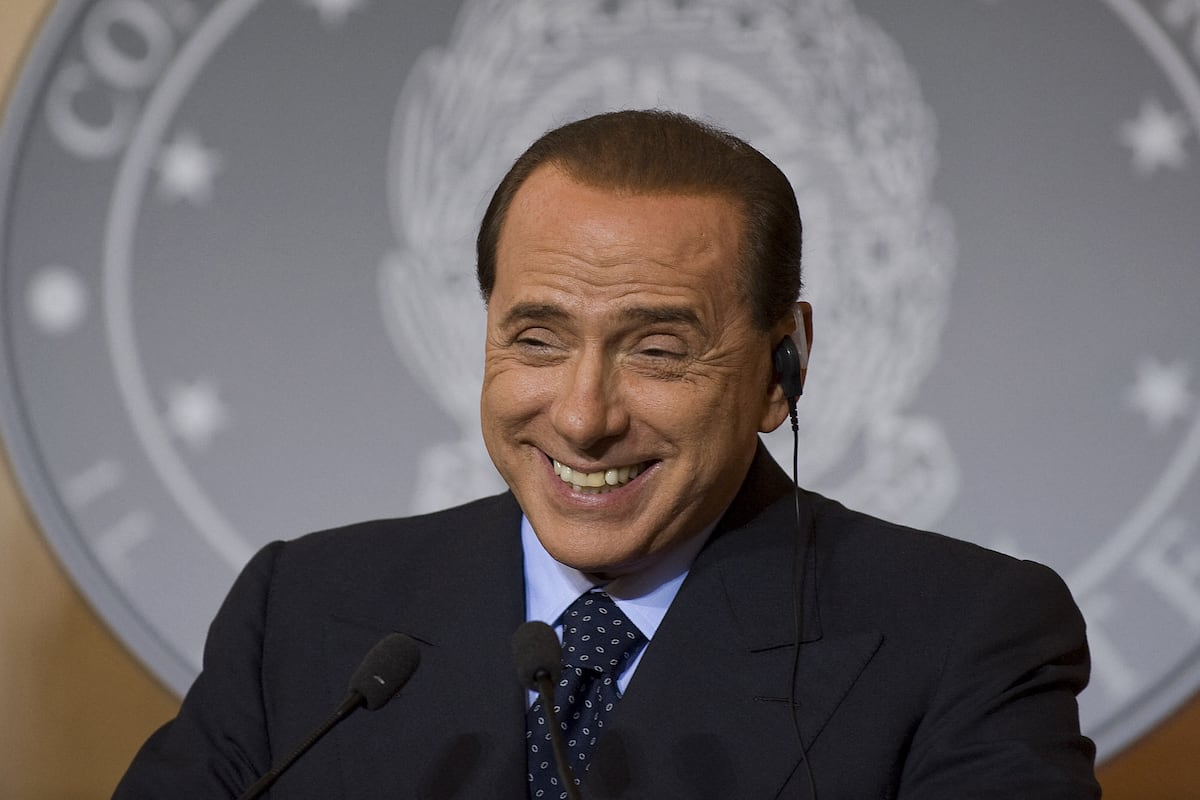 (FILES) Italian Prime Minister Silvio Berlusconi smiles while answering a question on the next US President during a joint press conference with US President George W. Bush at Villa Madama in Rome, Italy, June 12, 2008. President Bush, on the third stop of what he calls his final Europe trip as president, was seeking more help for war-battered Afghanistan and a tougher line on Iran's defiant nuclear drive. Berlusconi, whose previous government staunchly backed the March 2003 US-led invasion of Iraq, was to press his fellow conservative to add Italy to the group of major powers spearheading diplomacy with Tehran. AFP PHOTO/JIM WATSON. Italian ex-prime minister Silvio Berlusconi died at age 86. (Photo by Jim WATSON / AFP)