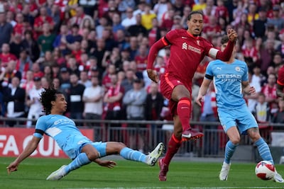 Virgil van Dijk, right, is challenged by Nathan Ake during the FA Cup semi-final between Liverpool and Manchester City. AP