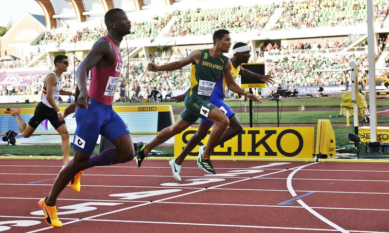 Champion Allison, Wayde Van Nierkerk and Jonathan Jones cross the finish line in the men's 400m semi final at the World Athletics Championships. EPA