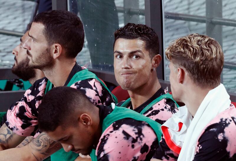 Cristiano Ronaldo, second from right, of Juventus sits on the bench prior to a friendly match against Team K League at the Seoul World Cup Stadium in Seoul, South Korea, Friday, July 26, 2019. (AP Photo/Ahn Young-joon)