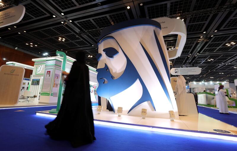 Dubai, United Arab Emirates - Reporter: Patrick Ryan. News. The Dubai International Humanitarian Aid & Development Conference (DIHAD). A lady walks passed the Mohammed bin Rashid Global Initiatives booth. Monday, March 15th, 2021. Dubai. Chris Whiteoak / The National