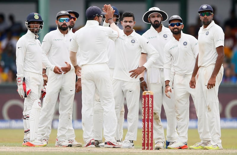 Cricket - Sri Lanka v India - Second Test Match - Colombo, Sri Lanka - August 6, 2017 India's Ravindra Jadeja celebrates with his teammates after taking the wicket of Sri Lanka's Dimuth Karunaratne. REUTERS/Dinuka Liyanawatte
