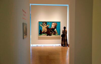 A visitor observes an artwork by Spanish artist Pablo Picasso displayed at the Sursock Museum in the Lebanese capital Beirut on September 27, 2019. Lebanon launched its first exhibition of late Spanish artist Pablo Picasso's works this month with more than 20 works centred around the theme of family, organisers said. The exhibition will run until January next year.
 / AFP / JOSEPH EID
