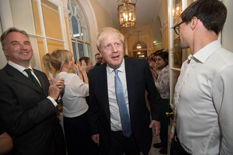 New PM Boris Johnson is welcomed by staff at Downing Street on July 24, 2019