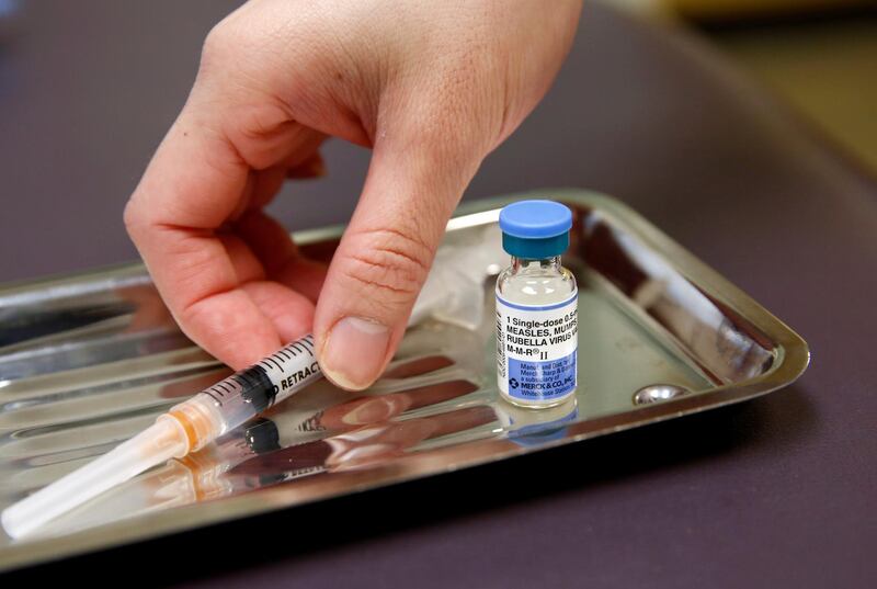 FILE PHOTO: A vial of the measles, mumps, and rubella virus (MMR) vaccine is pictured at the International Community Health Services clinic in Seattle, Washington, U.S., March 20, 2019. Picture taken March 20, 2019.  REUTERS/Lindsey Wasson/File Photo