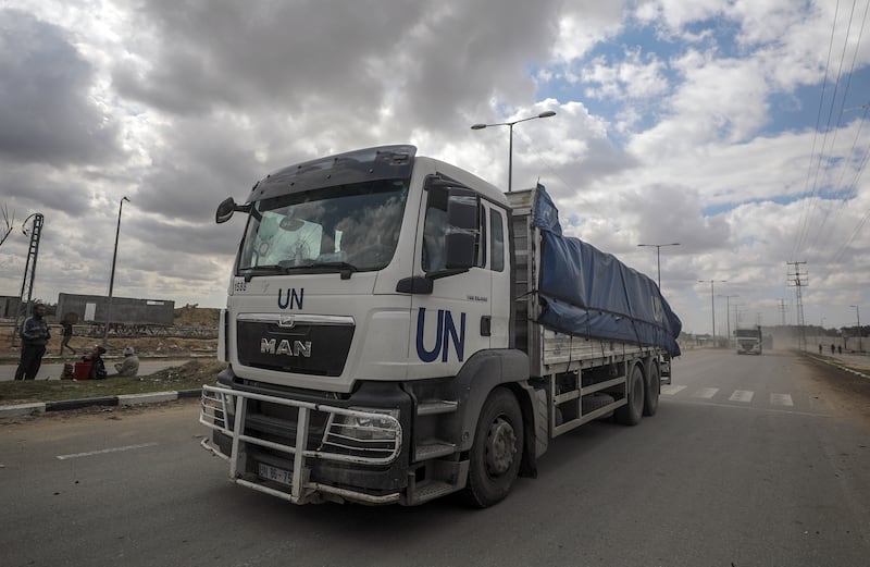 Trucks carrying aid to Gaza cross from the border with Egypt on March 8. The limited amounts of supplies delivered so far are not enough to meet people's needs and NGOs have called for full road access to the enclave. EPA