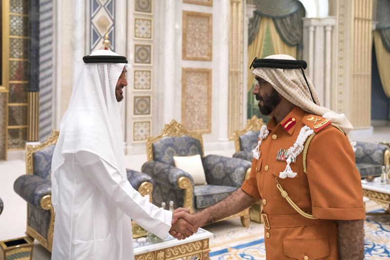 ABU DHABI, UNITED ARAB EMIRATES - May 20, 2018: HH Sheikh Mohamed bin Zayed Al Nahyan Crown Prince of Abu Dhabi Deputy Supreme Commander of the UAE Armed Forces (L), receives HE Major General Abdullah Muhair Al Ketbi (R), during an iftar reception at the Presidential Palace. 

( Hamad Al Kaabi / Crown Prince Court - Abu Dhabi )
---