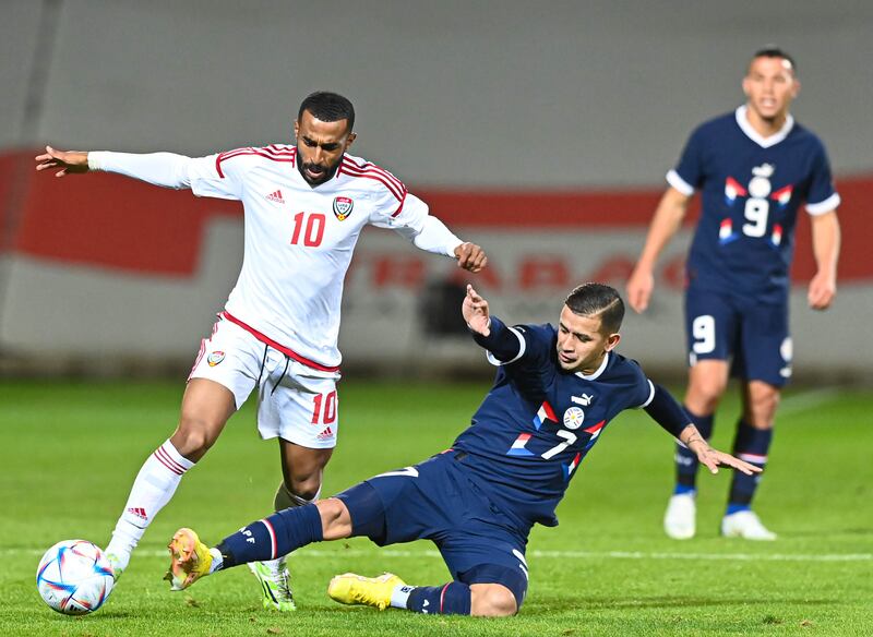 Tahnoon Alzaabi skips a challenge from Derlis Gonzalez during the UAE's friendly against Paraguay. Photo: UAE FA