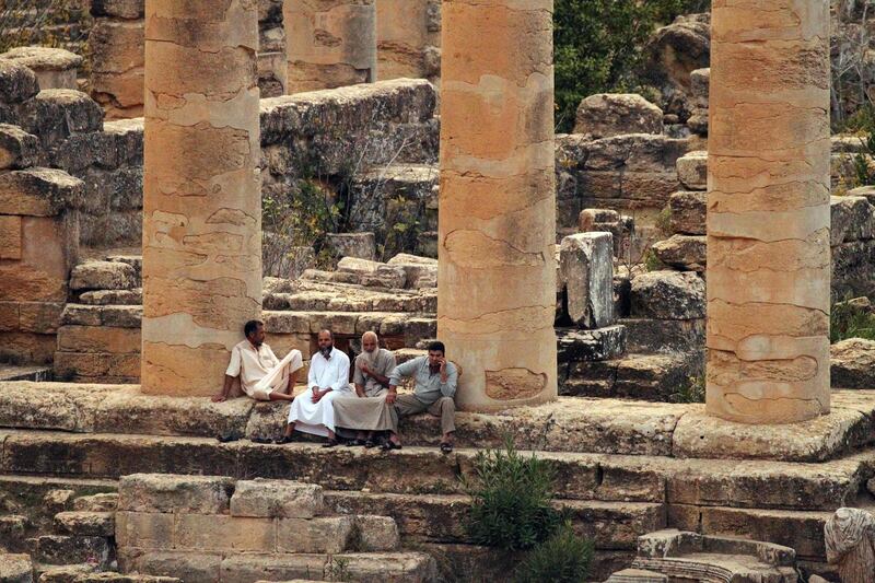 A general view shows people visiting ruins at the archaeological site of the ancient Greek city of Cyrene, a colony of the Greeks of Thera (Santorini) and a principal city in the Hellenic world founded in 630 BC, located in the suburbs of the Libyan eastern town of Shahat. AFP