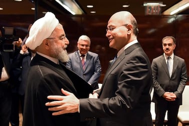 Iraq's President Barham Salih shakes hands with Iran's President Hassan Rouhani in New York on September 25, 2019. Reuters 