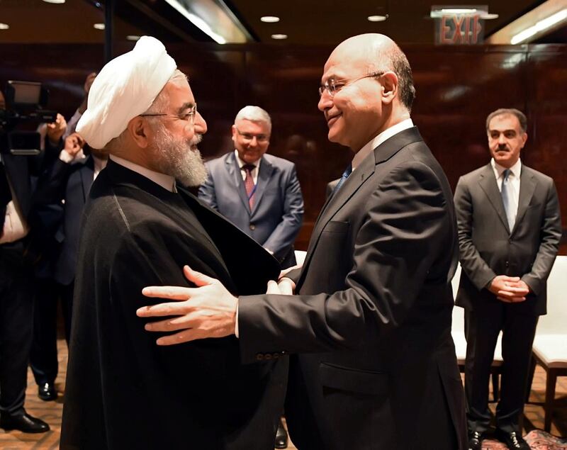 Iraq's President Barham Salih shake hands with Iran's President Hassan Rouhani in New York, U.S., September 25, 2019. Picture taken September 25, 2019.The Presidency of the Republic of Iraq Office/Handout via REUTERS ATTENTION EDITORS - THIS IMAGE WAS PROVIDED BY A THIRD PARTY.