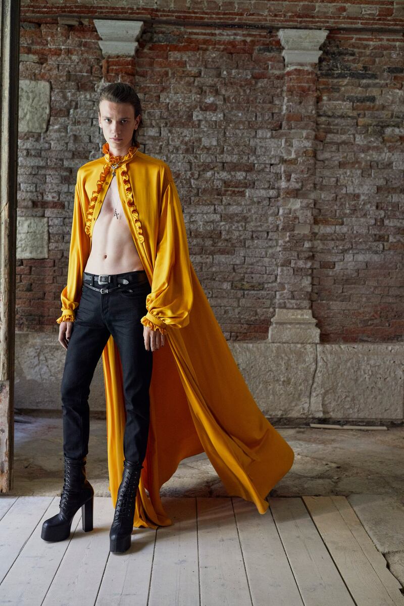 This golden yellow cape was lifted straight from the 1983 fall haute couture collection for women, at Saint Laurent men's spring / summer 2022. Courtesy Saint Laurent