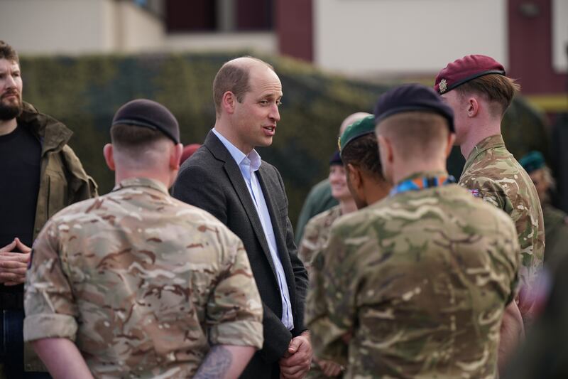 Prince William meets members of the British military during his visit to the 3rd Brigade Territorial Defence Force base. Getty