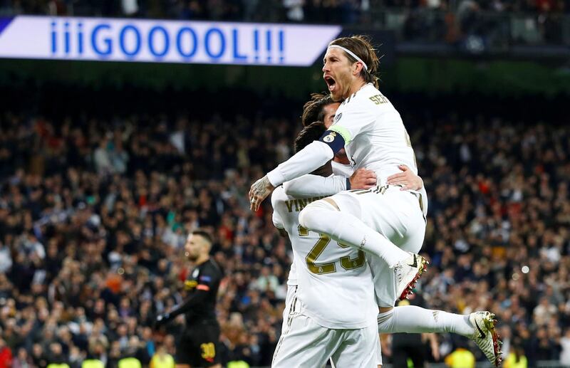 Real Madrid's Isco celebrates scoring their goal with Vinicius Junior and Sergio Ramos. Reuters