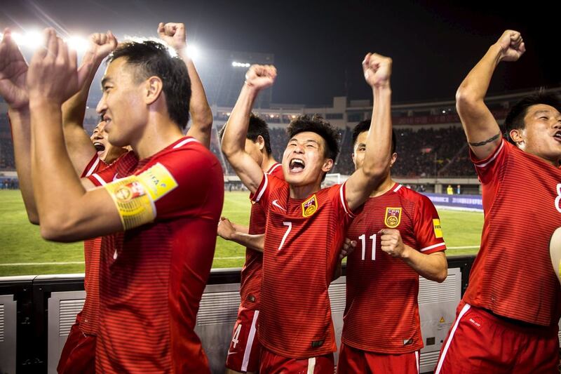Football Soccer - China v Qatar - World Cup 2018 Qualifier - Shaanxi Province Stadium, Xi'an, China - 29/3/16. Wu Lei of China celebrates with teammates after winning against Qatar. REUTERS/Stringer ATTENTION EDITORS - THIS PICTURE WAS PROVIDED BY A THIRD PARTY. THIS PICTURE IS DISTRIBUTED EXACTLY AS RECEIVED BY REUTERS, AS A SERVICE TO CLIENTS. CHINA OUT. NO COMMERCIAL OR EDITORIAL SALES IN CHINA.